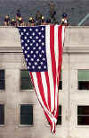 Image  Washington Post. Firemen and US Flag on the Pentagon.