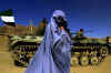 Click on the Afghan woman in a burqa and a Northern Alliance tank for a larger image.