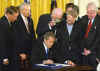 Click on the October 26 Bush anti-terrorism bill signing photo for a larger image.
